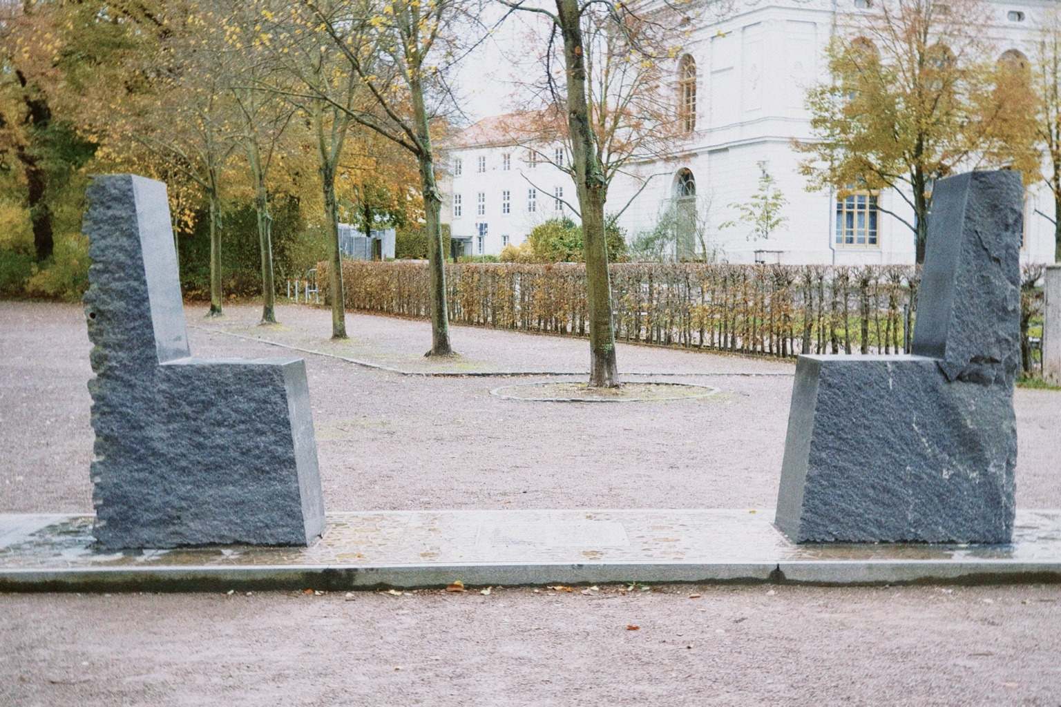 Two monumental granite chairs facing each other at the Hafez–Goethe Monument in Weimar.